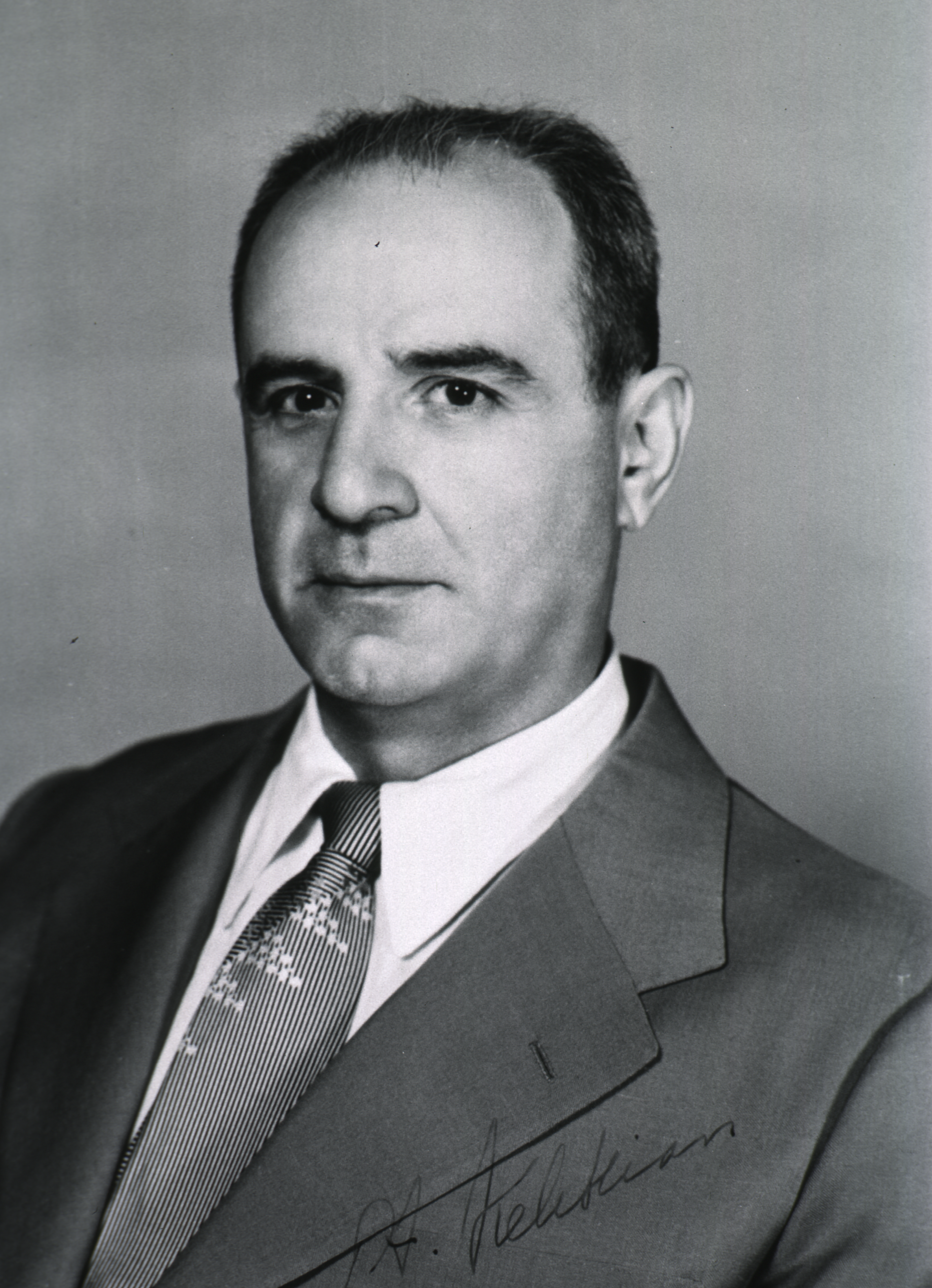 Portrait of a young doctor Hampar Kelikian in a suit and tie.